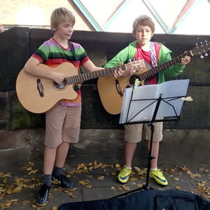 Students of Chris Stevens busking on the streets of Chester
